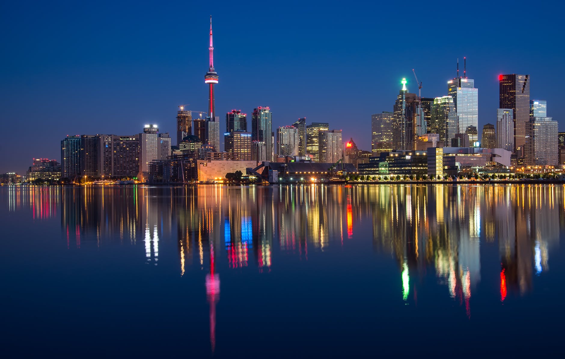 buildings near body of water at night