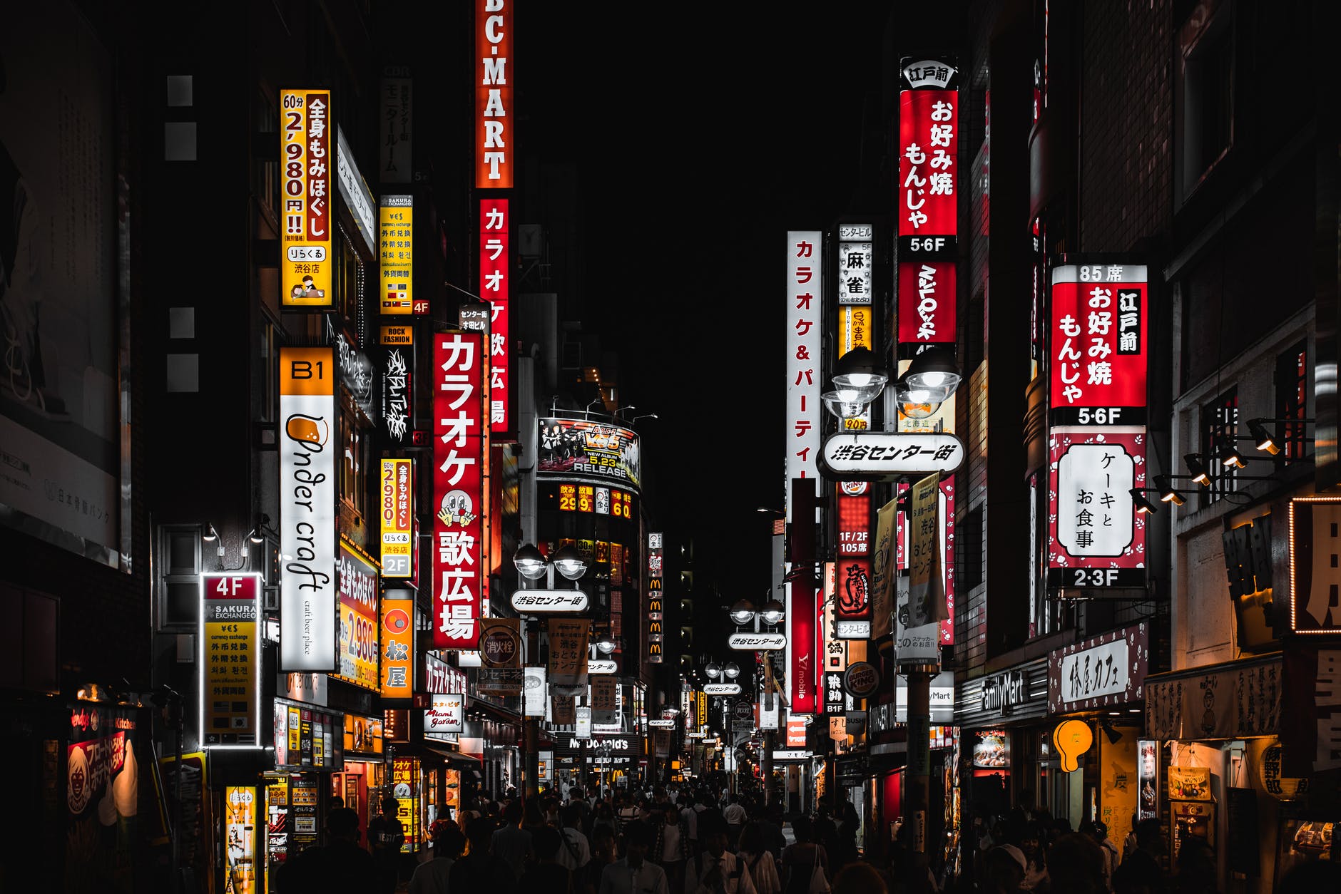 people walking on street during nighttime