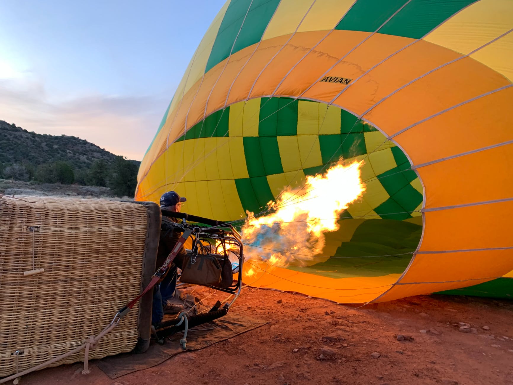 a man inflating a hot air balloon